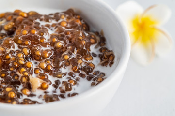 Thai desserts, sago desserts with longan topped with coconut milk