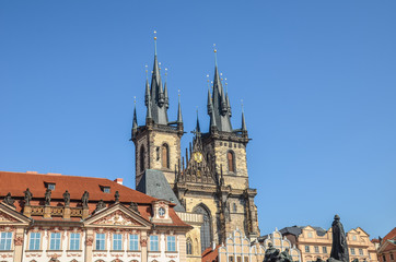 Fototapeta na wymiar Historical buildings in the old town with the front side of the Church of Our Lady before Tyn in Prague, Czech Republic. Old Town Square in Praha, Czechia. Tourist landmarks. Horizontal photo