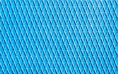 blue iron wall with intersecting lines close up