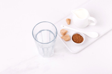 ingredients for dalgona coffee, milk and cane sugar. South Korean summer drink