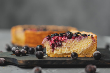 Image of Blueberry cheesecake, tart with blueberries and black currants, dessert on a gray background printed on Printed Glass Splashbacks