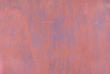 texture of a rusty metal sheet with peeling red paint. rusty iron background