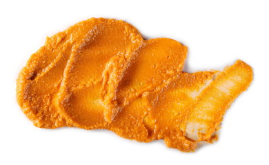 Tomato flavored hummus isolated on white background, top view