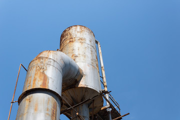 Sloss Furnaces National Historic Landmark, Birmingham Alabama USA, large industrial structure, rust and riveted tubes and pipes, against a beautiful blue sky, creative copy space