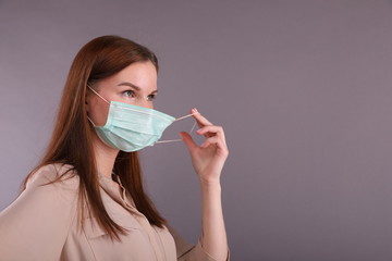 Nurse puts on Surgical mask for protect coronavirus