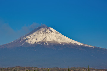 snowy popocatepetl volcano with blue sky