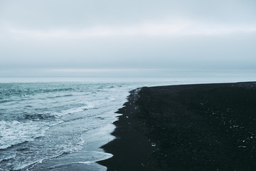 Calm black sand beach in Iceland