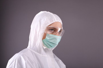 Woman in protective equipment against respiratory diseases