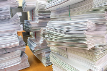 bundles bales of paper documents. stacks packs pile on the desk in the office