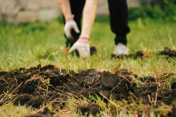 Close up man digs soil with metal shovel. Digging ground for plant seeding. Agriculture concept. Worker in gloves 