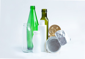 Glass garbage, plastic, aluminium on a gray background.