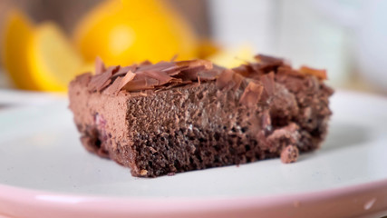 Fototapeta na wymiar Chocolate tasty cake with spoon on table, close-up