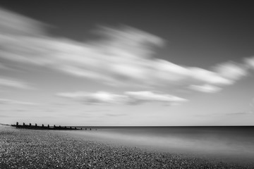 black and white photo of the beach in england