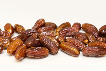 dried dates on a white background