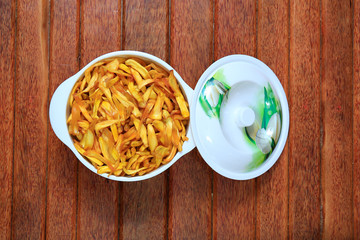 Jack fruit fry in the white bowl isolated on wooden background
