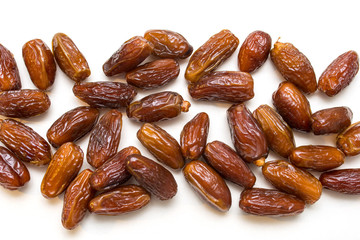 dried dates on a white background
