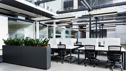 Rental office with computers wrapped in cover, no people