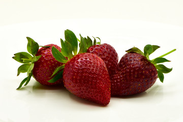 strawberries with strawberry leaf on white background.
