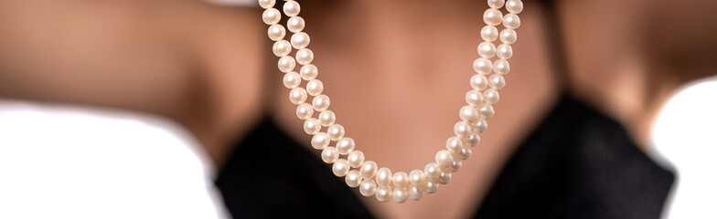 woman wearing pearl diamond necklace