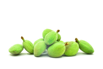 some green almonds on a white background
