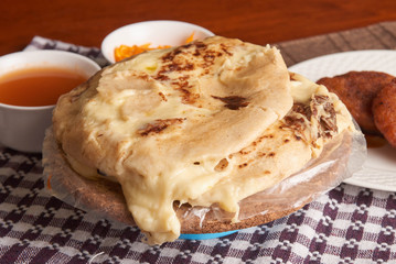 Close up photo of pupusas dish with nuegados, a traditional meal from El Salvador