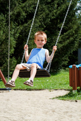 Boy On Swing Playing