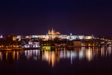 Fototapeta na wymiar Beautiful night lights in Prague, overlooking the Prague Castle encasing the St. Vitus Cathedral!