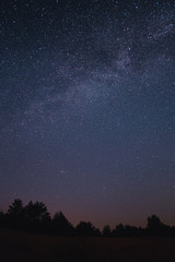 Landscape with blue Milky Way. Night sky with stars. Beautiful milky way taken in Ukraine during a...