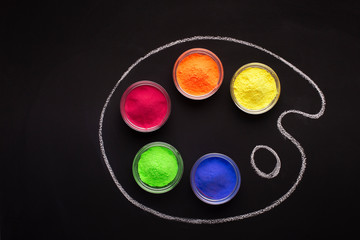 Paints for Holi in palette, drawn in chalk