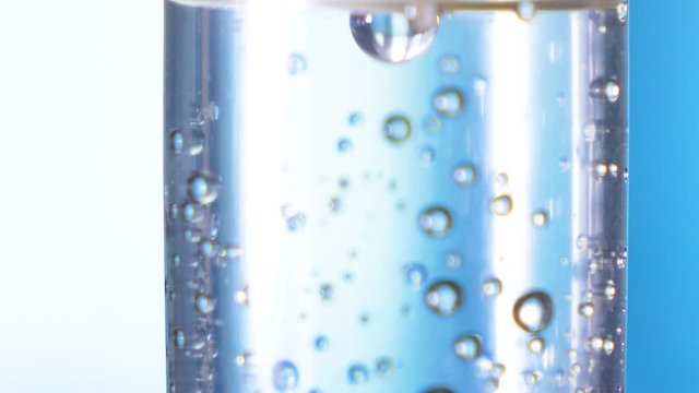Dripping medical perfusion close up equipment in clinic background. Saline Solution IV Drip Fluid for Infusion in Hospital. Intravenous infusion tube equipment in hospital. Viral infection