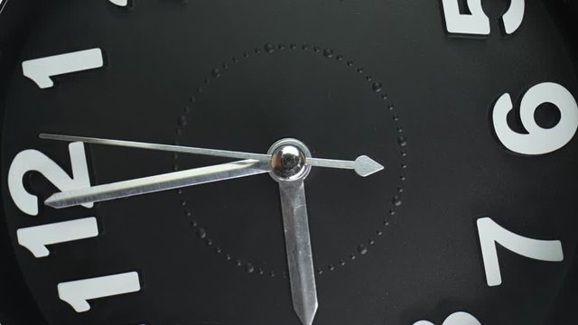 Zoom Out Macro Shot Of Clock Face With Rapid Rotation And Almost Static Seconds Arrow. Fast Flow Of Time Concept. Real Watch Shot With Macro Lens Close-up View. 4k.