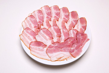 Many slices of bacon on a plate
