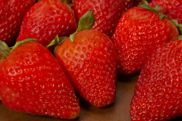 background of red strawberries on the table ready to eat
