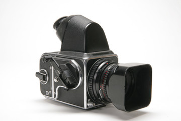 Medium format vintage film camera with film wind crank. 2 1/4 format camera shot on white background 