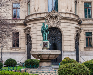 Fountain on the background the facade of Metropolitan Ervin Szabo Library in Budapest