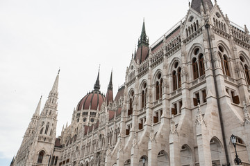 Fototapeta premium Hungarian Parliament building in the city of Budapest. Budapest at sunrise with clear blue sky. A sample of neo-gothic architecture, Budapest tourist attraction