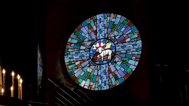 Religious Stained Glass Window inside Church during Service