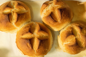 Close up top view on small bread buns fresh baked homemade organic bakery