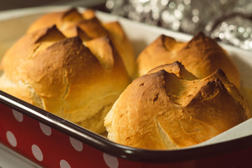 Close up side view on small bread buns fresh baked homemade organic bakery