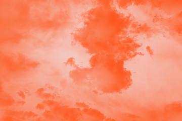 Beautiful bright orange clouds in a light orange sky