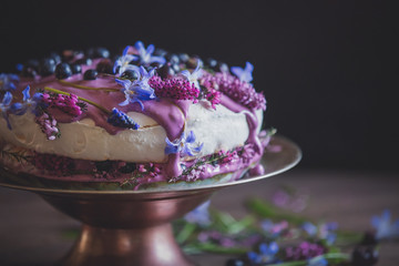 meringue pie with blueberry cream on a table at home