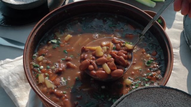 Pouring bean soup into a plate PART2 Slow motion