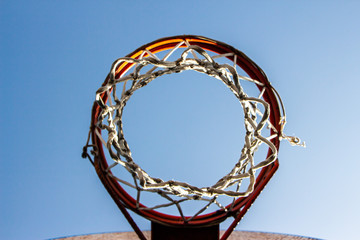 Vintage basketball ring with a blue sky background. Selective Focus.