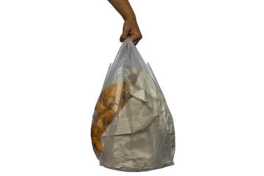 Ramadan Concept, Close-up Of Woman's Hand Is Holding A Sachet With Pita Bread On White Background.