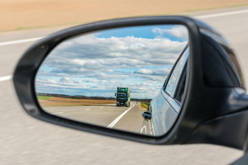 Fototapeta premium view of the outside car rearview mirror