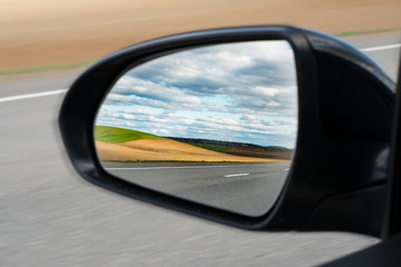 Fototapeta premium view of the outside car rearview mirror
