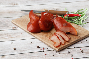 Meat smoked jerky - raw meat sausage meat. Close up view on tasty sliced Chicken basturma on...
