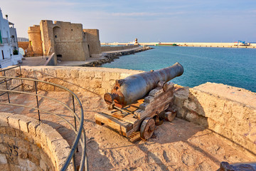 Medieval Defense Cannon and Turret In Front Of Castle Carlo V in beautiful Monopoli - Apulia - Puglia - Italy