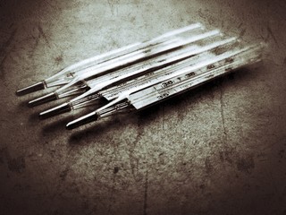 Old mercury thermometers on the table