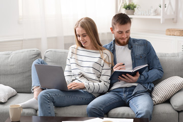 Millennial couple studying and working online at home